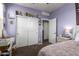 Bedroom with carpet flooring, white trim, vanity, and comic books at 4061 N 308Th Ln, Buckeye, AZ 85396
