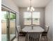 Bright dining area featuring sliding glass doors and a stylish chandelier at 4061 N 308Th Ln, Buckeye, AZ 85396
