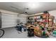 Spacious garage with ample storage shelving and overhead door, perfect for organization at 4061 N 308Th Ln, Buckeye, AZ 85396