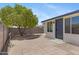 The brick patio area features a mature shade tree, providing a tranquil outdoor space at 4347 E Catalina Cir, Mesa, AZ 85206