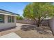 Backyard offers a combination of gravel and brick, complemented by a mature shade tree at 4347 E Catalina Cir, Mesa, AZ 85206
