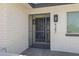 Close-up of a front door with a decorative security gate and brick facade at 4347 E Catalina Cir, Mesa, AZ 85206