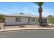 Inviting home with desert landscaping, and a grey two car garage at 4347 E Catalina Cir, Mesa, AZ 85206