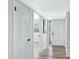 Bright hallway with wood-look flooring leading to other rooms of the home at 4347 E Catalina Cir, Mesa, AZ 85206