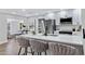 Modern kitchen with white cabinets, stainless appliances, and seating at the island at 4347 E Catalina Cir, Mesa, AZ 85206