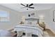 Comfortable main bedroom with a ceiling fan, plush bedding, and stylish decor at 4347 E Catalina Cir, Mesa, AZ 85206