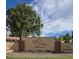 Sunland Village Golf Club entrance sign with lush greenery and a blue sky backdrop at 4347 E Catalina Cir, Mesa, AZ 85206