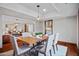 Elegant dining room with seating for six and views into the living spaces at 4518 E Solano Dr, Phoenix, AZ 85018