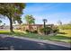 Single-story home with a well-maintained lawn, mature trees, and desert landscaping at 4518 E Solano Dr, Phoenix, AZ 85018