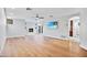 Bright living room featuring a fireplace, hardwood floors, and large windows at 4518 E Solano Dr, Phoenix, AZ 85018