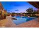 Beautiful pool with a spa, outdoor kitchen, and a fire pit, perfect for relaxing evenings at 4518 E Solano Dr, Phoenix, AZ 85018