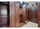 Spacious walk-in closet with custom shelving, drawers, and ample storage space at 4518 E Solano Dr, Phoenix, AZ 85018