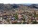 Aerial view of the community nestled in the hills, showcasing scenic views and surrounding desert landscape at 4547 E Buist Ave, Phoenix, AZ 85044
