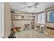 Functional room with guitar, music stand, and shelves, offering space for hobbies and creative endeavors at 4547 E Buist Ave, Phoenix, AZ 85044