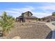 Well-maintained two-story home with brick accents, mature landscaping, and a large driveway at 4547 E Buist Ave, Phoenix, AZ 85044