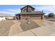 Two-story home boasts a manicured rock yard and a two car garage at 4547 E Buist Ave, Phoenix, AZ 85044