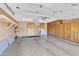 Spacious garage featuring epoxy floors, storage cabinets, and ample space for parking and organization at 4547 E Buist Ave, Phoenix, AZ 85044