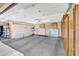 Spacious garage with epoxy flooring, ample storage cabinets and shelving offering plenty of room for vehicles and organization at 4547 E Buist Ave, Phoenix, AZ 85044