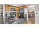 Bright kitchen featuring a black refrigerator, and ample cabinet space, open to the dining room at 4547 E Buist Ave, Phoenix, AZ 85044
