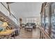 Elegant living room featuring a staircase, hardwood floors, and a display cabinet at 4547 E Buist Ave, Phoenix, AZ 85044