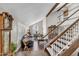 Bright living room features high ceilings, a cozy seating area, and elegant staircase at 4547 E Buist Ave, Phoenix, AZ 85044