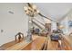 Well-lit living room showcasing the staircase, chandelier, and hardwood flooring at 4547 E Buist Ave, Phoenix, AZ 85044
