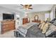 Bedroom boasts stylish furnishings, natural light, and an ensuite bath at 4547 E Buist Ave, Phoenix, AZ 85044
