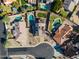 Aerial view of a neighborhood showcasing luxurious backyards with sparkling pools and landscaped yards at 4547 E Buist Ave, Phoenix, AZ 85044