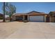 Charming single-story home with a two-car garage and low-maintenance desert landscaping in the front yard at 4623 W Solano S Dr # South, Glendale, AZ 85301