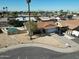 Aerial view displays a single-Gathering home in a neighborhood, close to desert landscaping and a blue, private pool at 4623 W Solano S Dr # South, Glendale, AZ 85301