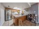 Updated kitchen featuring a stainless steel refrigerator, wood cabinets, tile floors and breakfast bar at 4623 W Solano S Dr # South, Glendale, AZ 85301