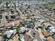 Aerial view captures a residential neighborhood with well-maintained homes, many featuring private swimming pools at 4623 W Solano S Dr # South, Glendale, AZ 85301