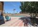 Inviting backyard pool with spacious patio, mature landscaping, and plenty of room for entertaining on a bright sunny day at 4623 W Solano S Dr # South, Glendale, AZ 85301