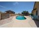 Sparkling in-ground pool surrounded by a concrete deck and brick paver wall at 4623 W Solano S Dr # South, Glendale, AZ 85301