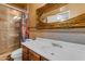 Bathroom featuring a vanity and decorative mirror and a glass enclosed walk-in shower at 4632 W Marlette Ave, Glendale, AZ 85301