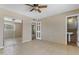 Bedroom with mirrored closet doors, ceiling fan, and an attached half-bathroom at 4632 W Marlette Ave, Glendale, AZ 85301