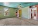 Spacious bedroom with a ceiling fan, ample lighting, and direct access to other rooms at 4632 W Marlette Ave, Glendale, AZ 85301