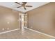 A standard bedroom with tile flooring and a closet doorway at 4632 W Marlette Ave, Glendale, AZ 85301