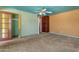 Room features aqua trim, ceiling fan, carpet, and closet space at 4632 W Marlette Ave, Glendale, AZ 85301