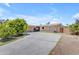 Charming single-story home featuring a spacious driveway, attached garage, and mature landscaping at 4632 W Marlette Ave, Glendale, AZ 85301