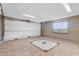 Spacious garage with tile floors, neutral paint, and updated lighting at 4632 W Marlette Ave, Glendale, AZ 85301