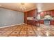 Kitchen featuring granite countertops, stainless steel appliances, and unique tile floor at 4632 W Marlette Ave, Glendale, AZ 85301
