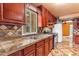 Close up of kitchen features, granite countertops, tile backsplash, and stainless appliances at 4632 W Marlette Ave, Glendale, AZ 85301