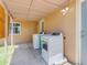 An outdoor laundry area with a washer and dryer beneath a covered patio at 4632 W Marlette Ave, Glendale, AZ 85301