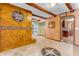 Open living area featuring tile floors, unique fireplace, arched doorway and exposed beam ceiling at 4632 W Marlette Ave, Glendale, AZ 85301