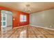 Well-lit room featuring tile flooring, chandelier and a large window at 4632 W Marlette Ave, Glendale, AZ 85301