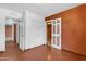 Room with vinyl floors leading to doorways with closets at 4632 W Marlette Ave, Glendale, AZ 85301