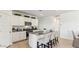 Modern kitchen features white cabinets, granite countertops, a breakfast bar, and stainless steel appliances at 48388 N Duran Way, Gold Canyon, AZ 85118