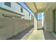 A covered patio looks out onto a low-maintenance backyard at 4927 S Tune --, Mesa, AZ 85212