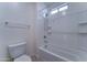 Bathroom with a bathtub and shower, a modern shower head, and a toilet at 4927 S Tune --, Mesa, AZ 85212